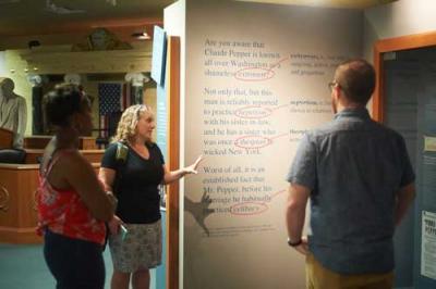 Patrons viewing an exhibit during a tour of special collections and archives