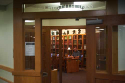 Entrance to special collections at Strozier library. Open double doors with a reception desk