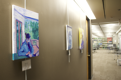 three paintings hanging in Dirac Science Library