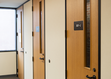 Row of three doors and a window at the end